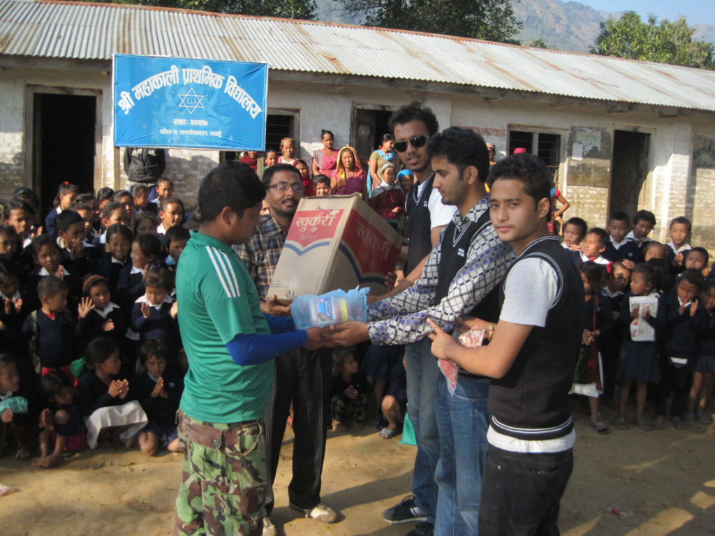 Nourish Nepal handing out sweaters at Mahakali school